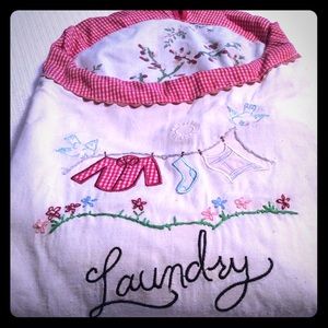 Laundry pouch with vintage clothes pins.